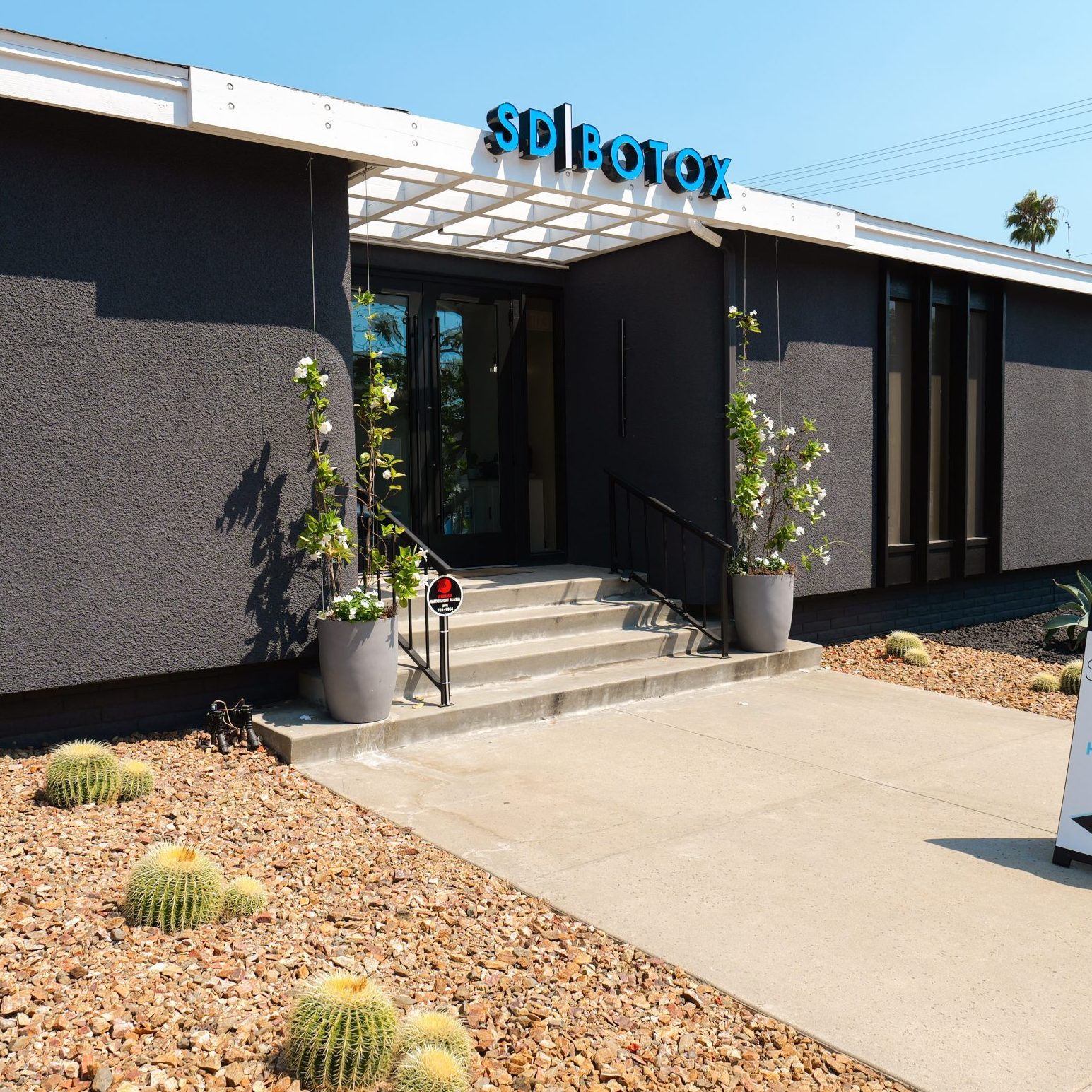 Modern building entrance with signage.